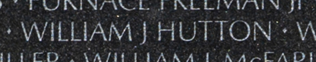 Petty Officer 2d Class William James Hutton engraved name on The Wall.